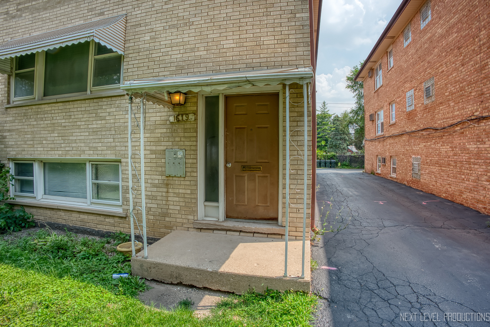 1619 35th Avenue Melrose Park, IL 60160 - Photo 3 of 35 a front view of a house with a garden