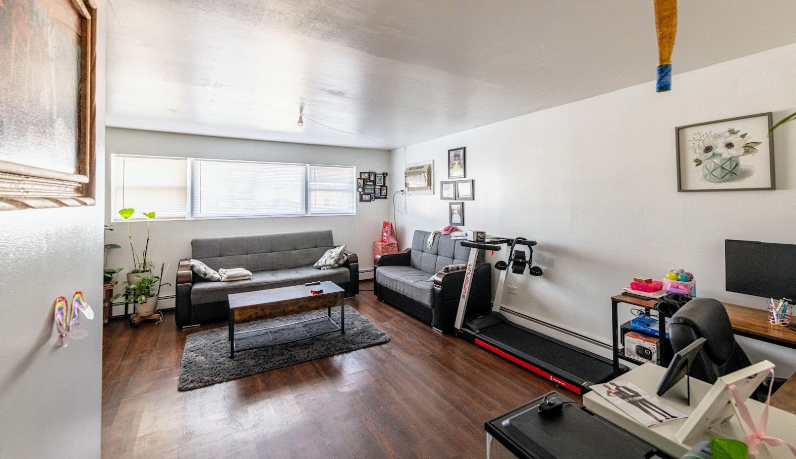 1619 35th Avenue Melrose Park, IL 60160 - Photo 4 of 35 a living room with furniture gym equipment and a flat screen tv