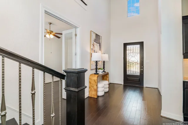 a view of entryway and hall with wooden floor