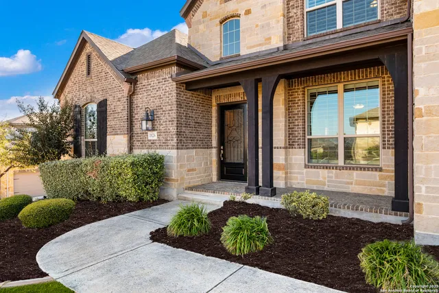 a front view of a house with garden