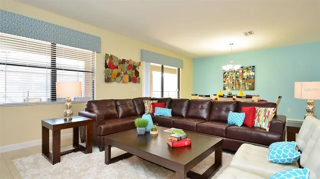 a living room with furniture and a large window