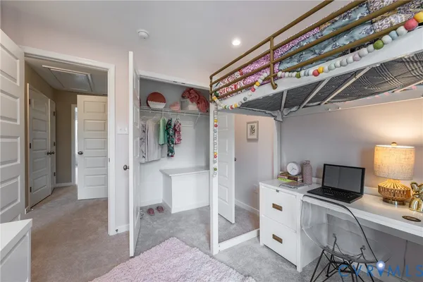 a kitchen with a refrigerator and cabinets