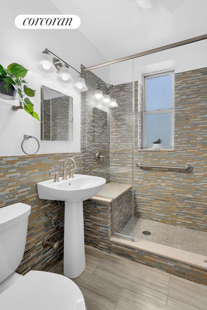 176 Seeley Street, Unit A7 Brooklyn, NY 11218 - Photo 6 of 7 a bathroom with a sink and mirror