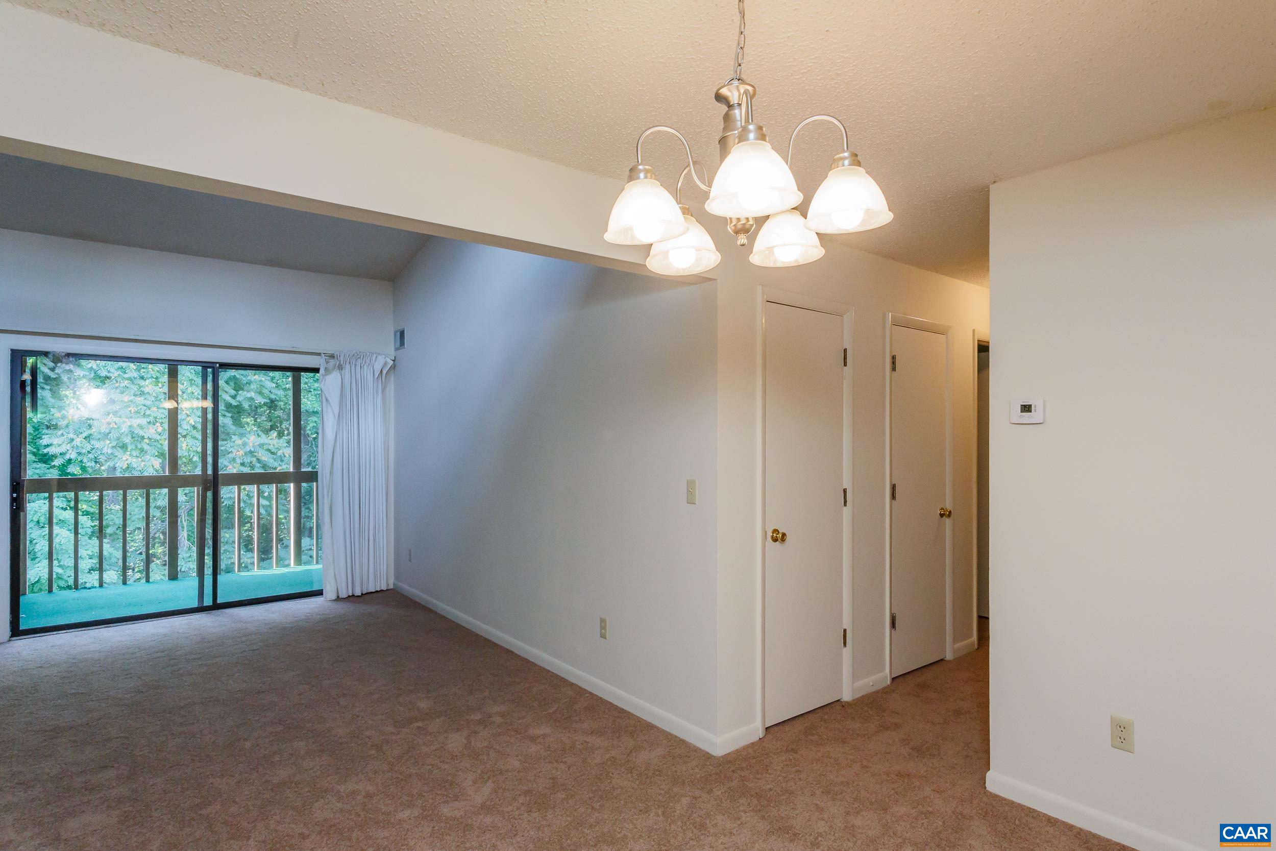 115 Turtle Creek Road, Unit 11 Charlottesville, VA 22901 - Photo 4 of 15 a view of a chandelier in a room