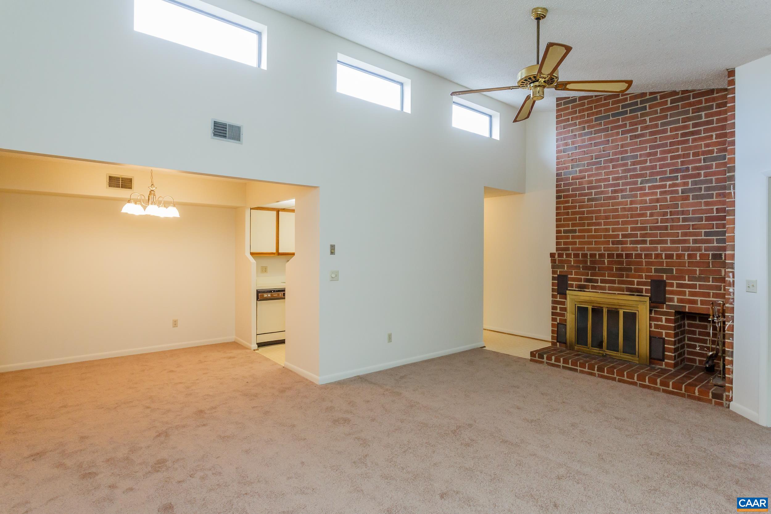 115 Turtle Creek Road, Unit 11 Charlottesville, VA 22901 - Photo 6 of 15 a view of an empty room with a fireplace