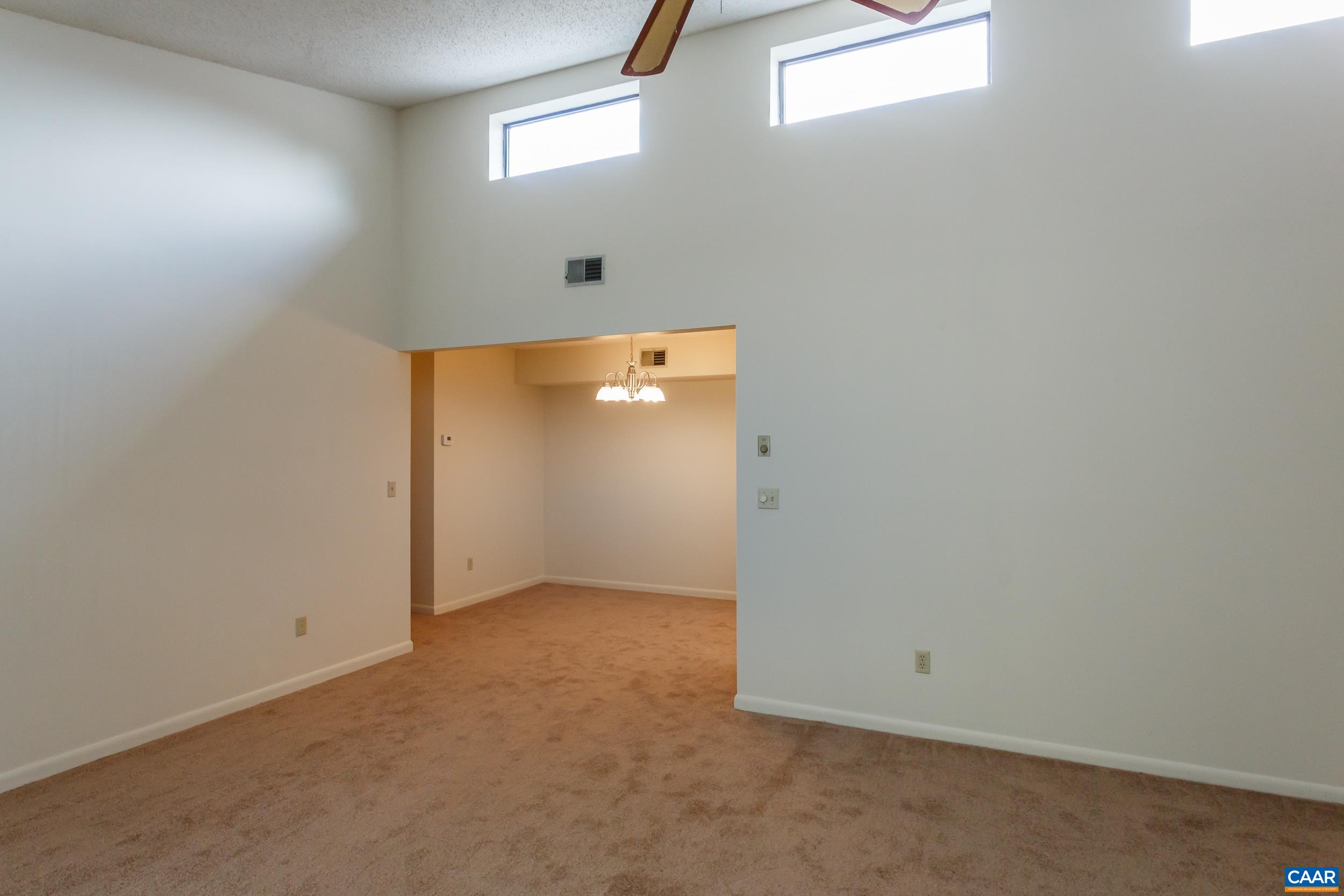 115 Turtle Creek Road, Unit 11 Charlottesville, VA 22901 - Photo 10 of 15 an empty room with windows