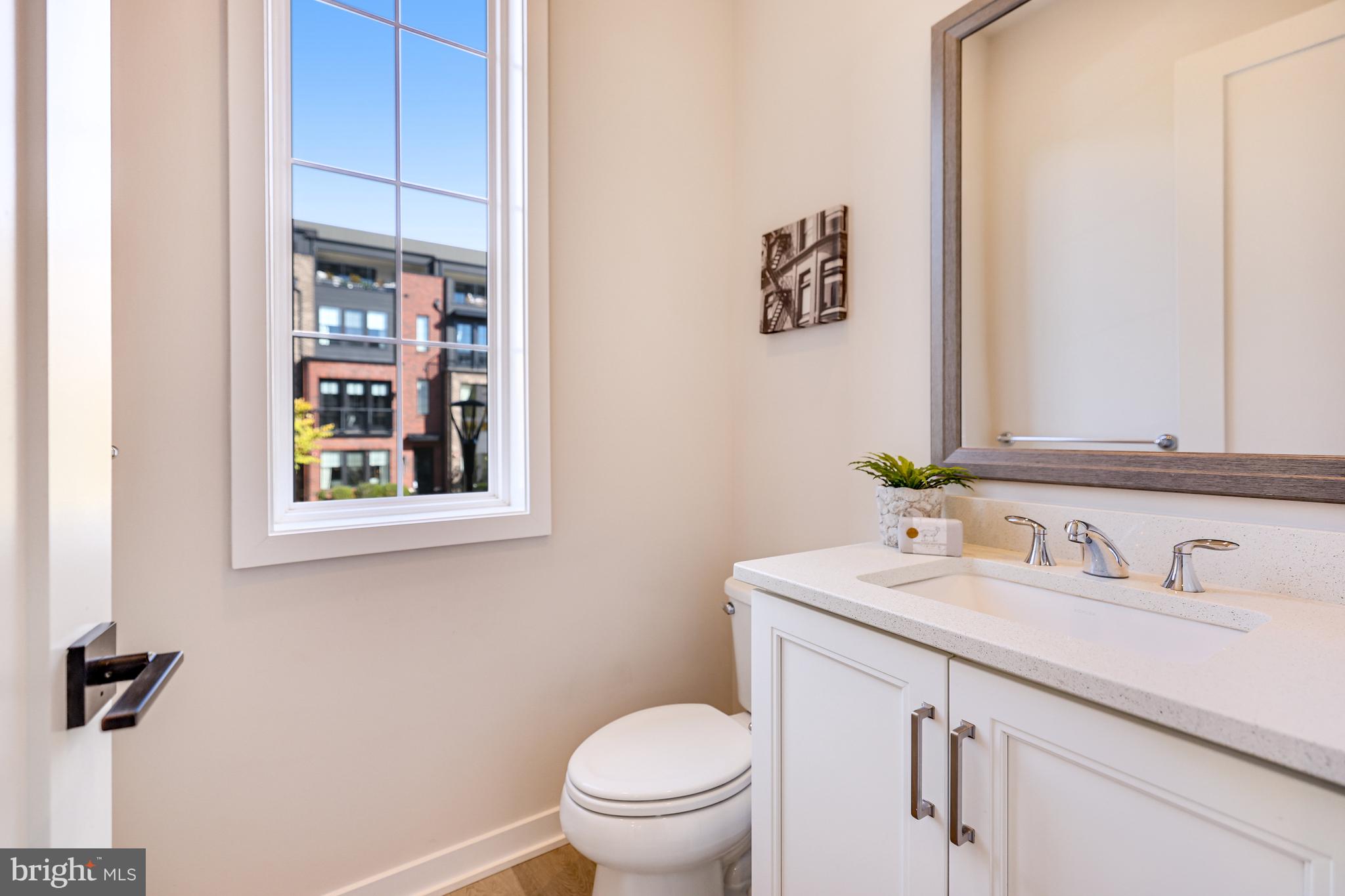11723 Paysons Way Reston, VA 20191 - Photo 20 of 51 a bathroom with a toilet sink and mirror