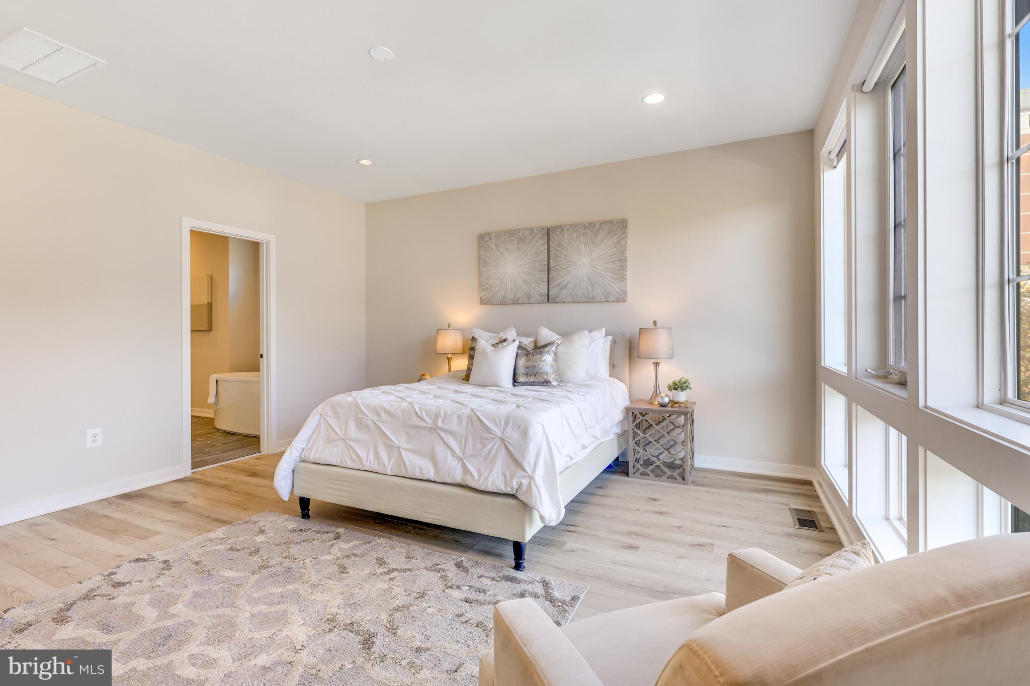 11723 Paysons Way Reston, VA 20191 - Photo 22 of 51 a bedroom with a bed and a window