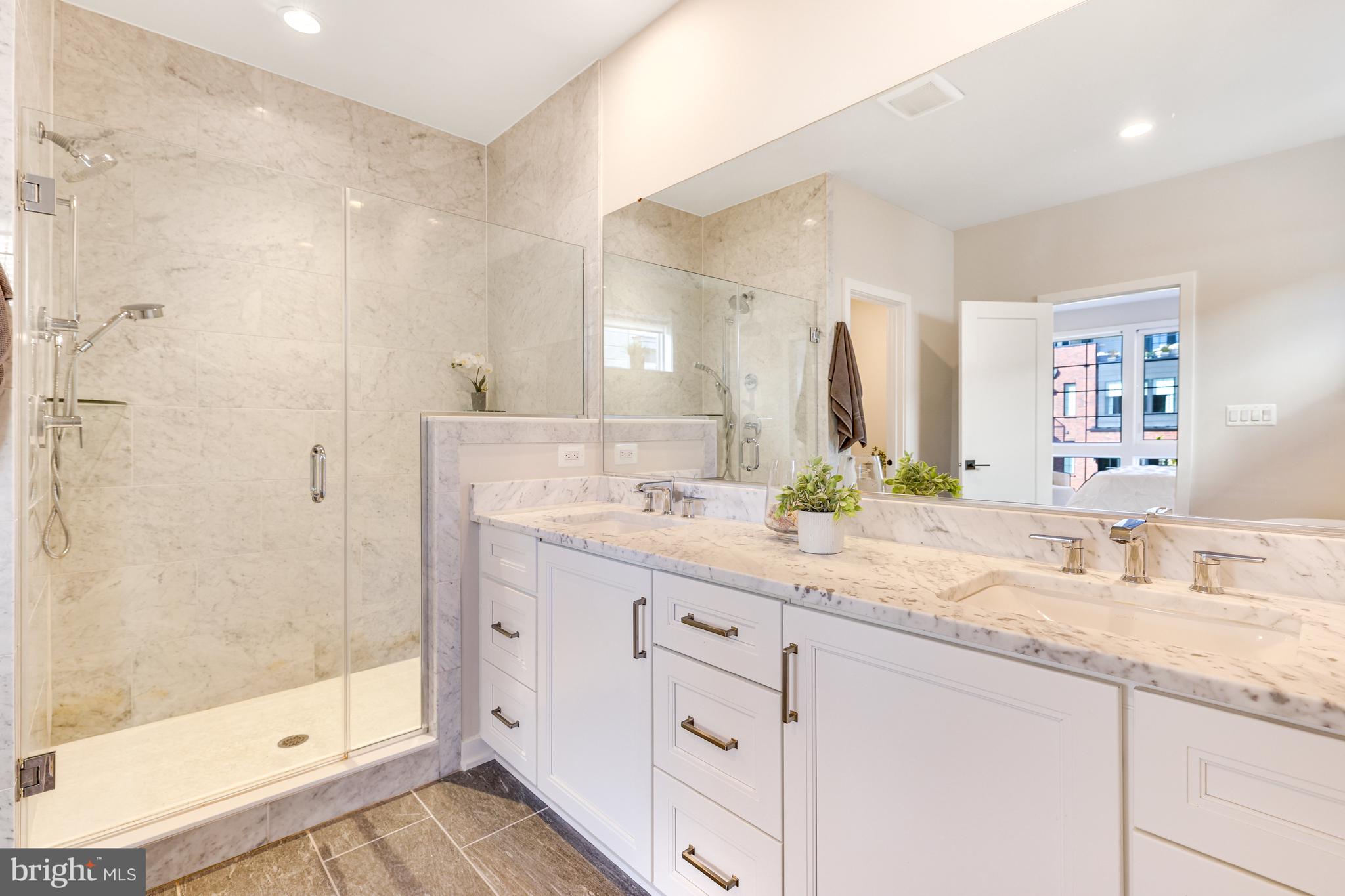 11723 Paysons Way Reston, VA 20191 - Photo 25 of 51 a bathroom with a granite countertop sink mirror and shower