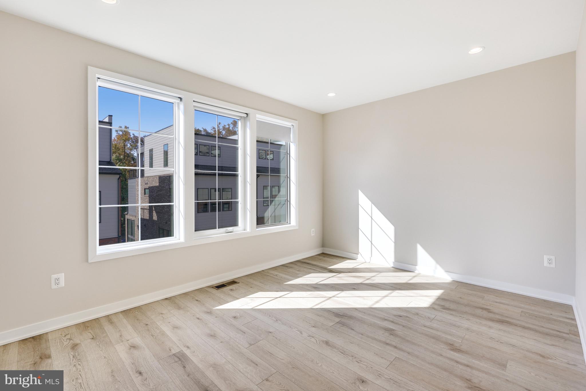 11723 Paysons Way Reston, VA 20191 - Photo 27 of 51 a view of empty room with wooden floor and fan