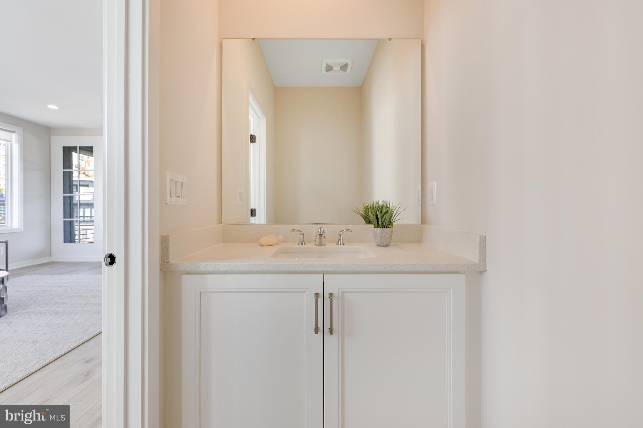 11723 Paysons Way Reston, VA 20191 - Photo 30 of 51 a bathroom with a granite countertop sink and a mirror