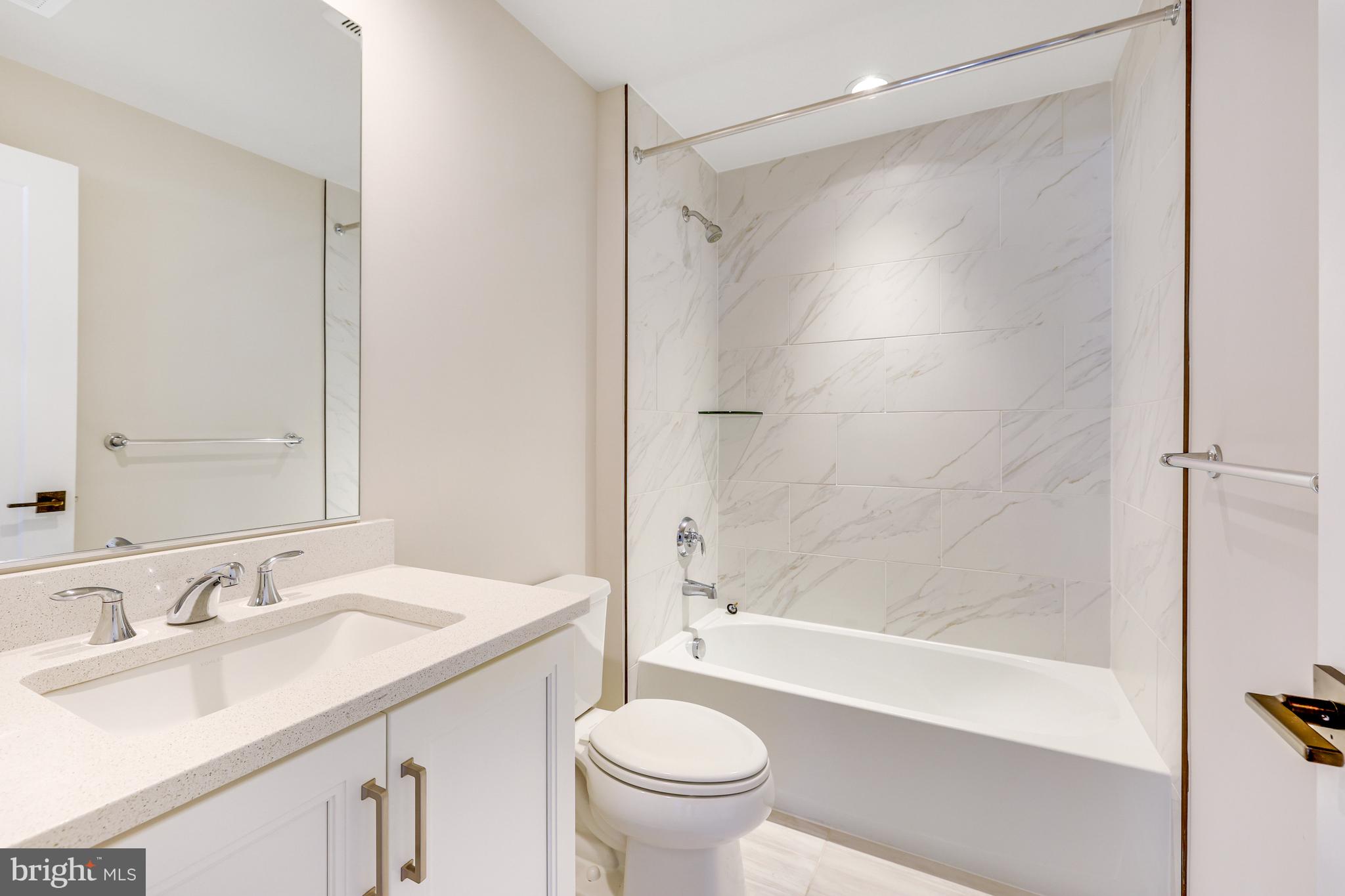 11723 Paysons Way Reston, VA 20191 - Photo 9 of 51 a bathroom with a sink toilet and shower