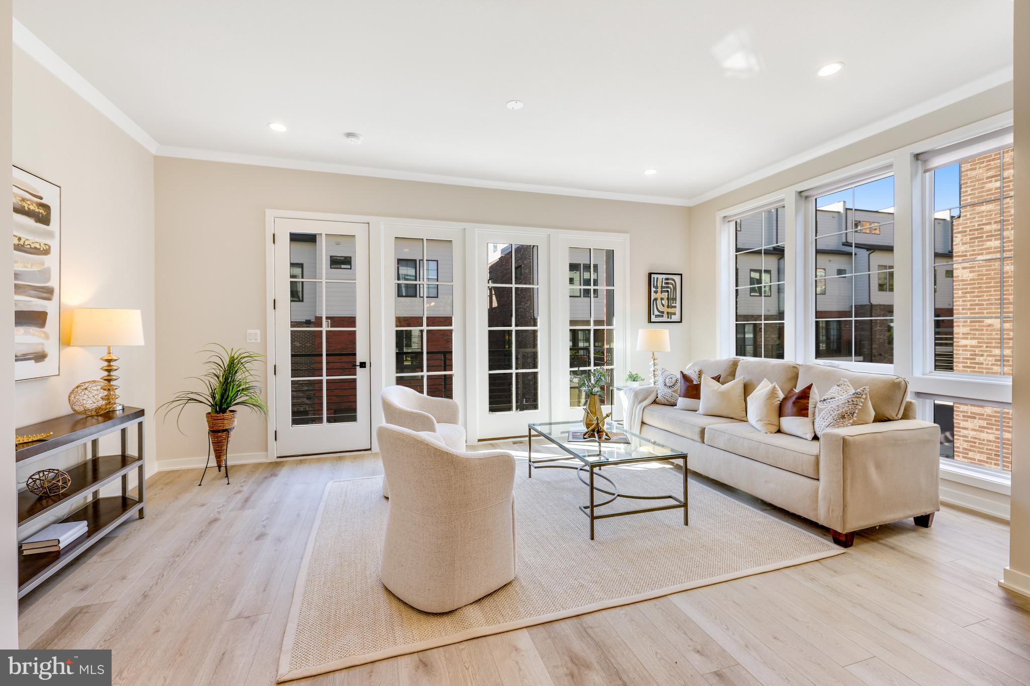 11723 Paysons Way Reston, VA 20191 - Photo 10 of 51 a living room with furniture and floor to ceiling windows