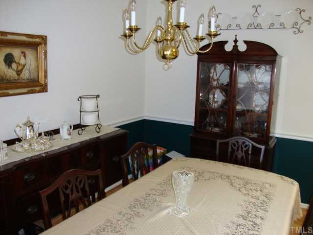 The ample dining room is open to the kitchen for easy flow of conversation. Whether it is a large group or a close few this dining room is perfect for all.
