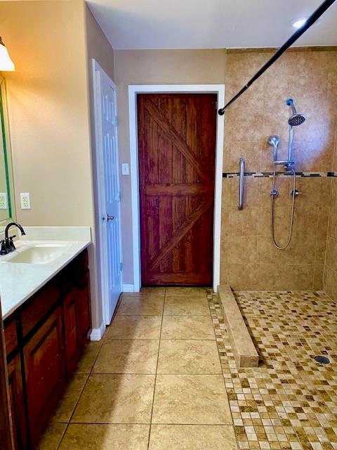 1220 Eva Street Edinburg, TX 78539 - Photo 11 of 21 a bathroom with a granite countertop sink a mirror and shower