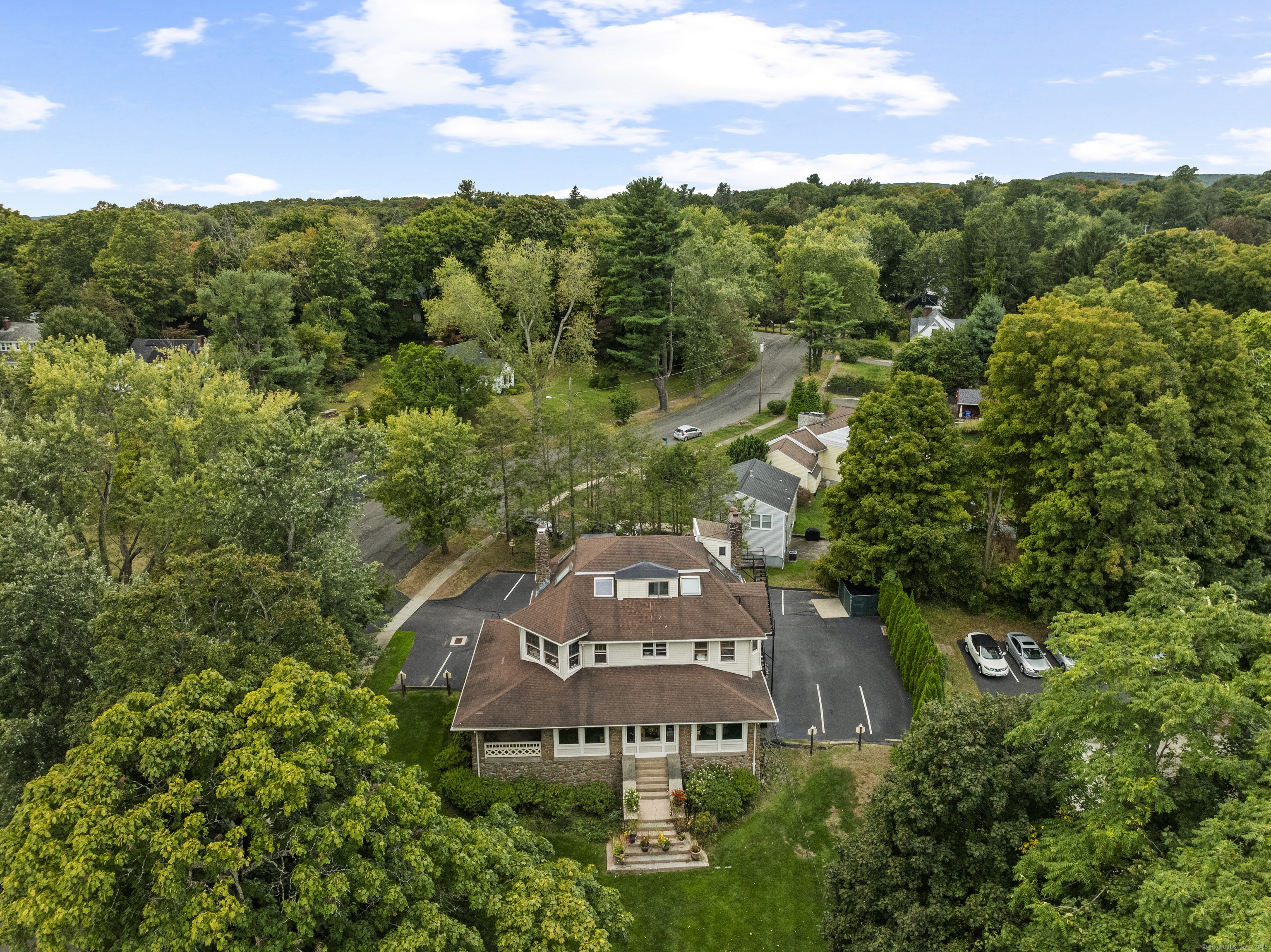 an aerial view of a chairs next to a building