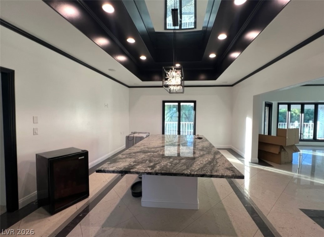 3003 Regency Hill Henderson, NV 89014 - Photo 7 of 13 A spacious, luminous living area with a dramatic tray ceiling and recessed lighting.