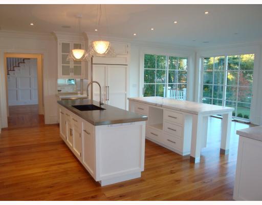 Undisclosed Address Darien, CT 06820 - Photo 2 of 10 a kitchen with counter top space and wooden floor