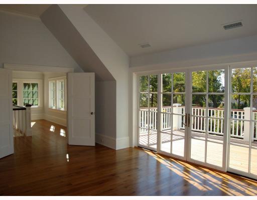 Undisclosed Address Darien, CT 06820 - Photo 5 of 10 a view of a room with wooden floor and windows