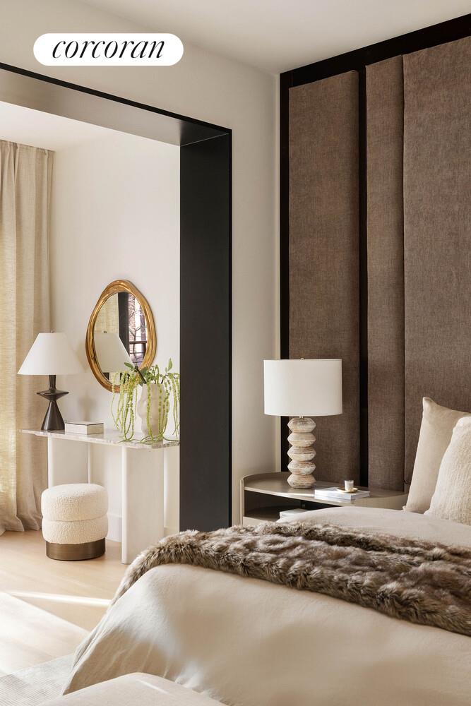 53 West 71st Street Manhattan, NY 10023 - Photo 19 of 41 a bedroom with a bed and a large mirror