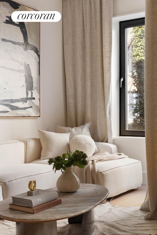 53 West 71st Street Manhattan, NY 10023 - Photo 20 of 41 a living room with furniture and window