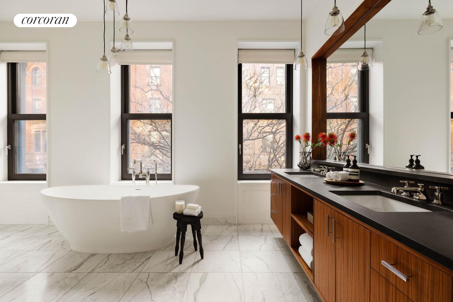 53 West 71st Street Manhattan, NY 10023 - Photo 22 of 41 a large kitchen with a window and stainless steel appliances