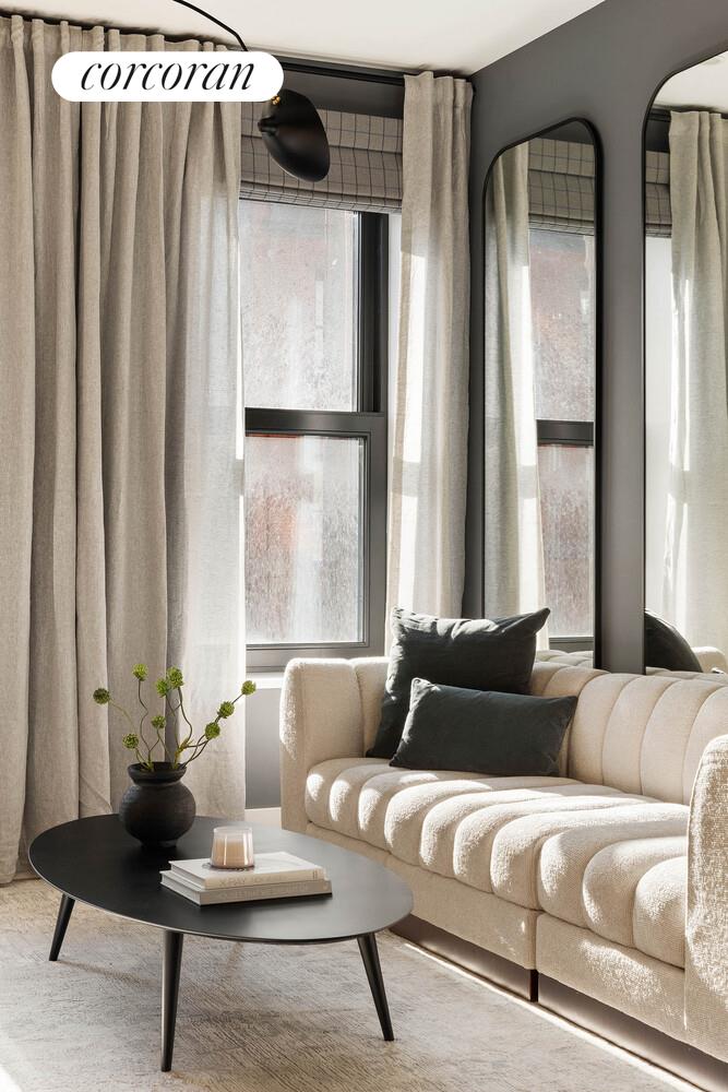 53 West 71st Street Manhattan, NY 10023 - Photo 28 of 41 a living room with furniture and a large window