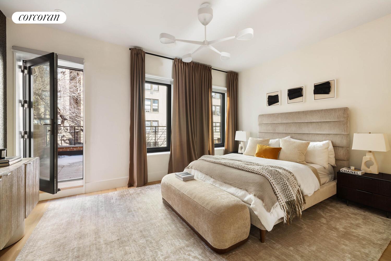 53 West 71st Street Manhattan, NY 10023 - Photo 30 of 41 a bedroom with a large bed and a chandelier