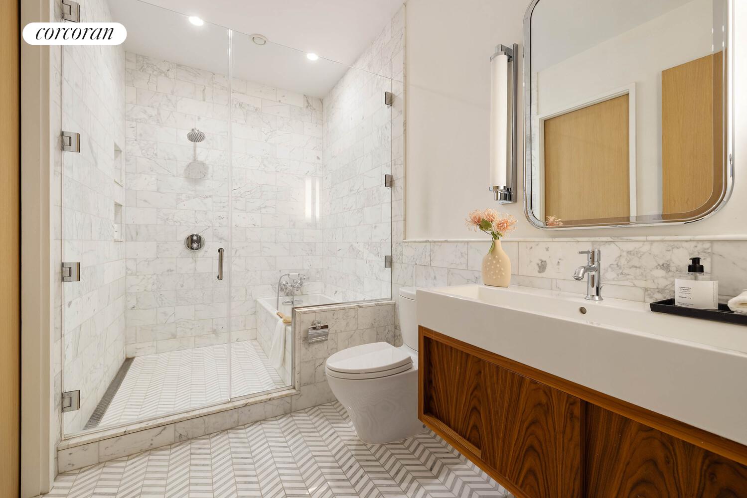 53 West 71st Street Manhattan, NY 10023 - Photo 31 of 41 a bathroom with a sink a toilet and shower