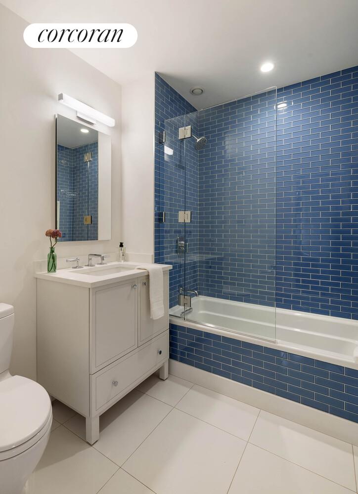 53 West 71st Street Manhattan, NY 10023 - Photo 33 of 41 a bathroom with a sink a toilet and shower