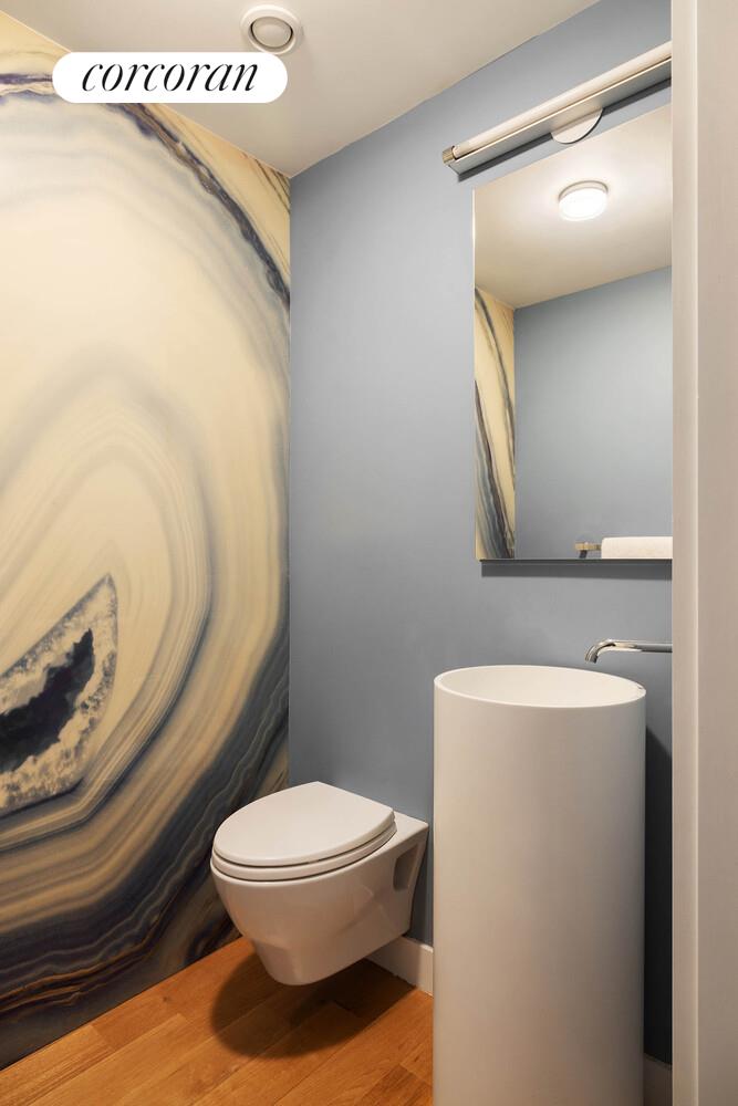 53 West 71st Street Manhattan, NY 10023 - Photo 38 of 41 a bathroom with a toilet sink and mirror