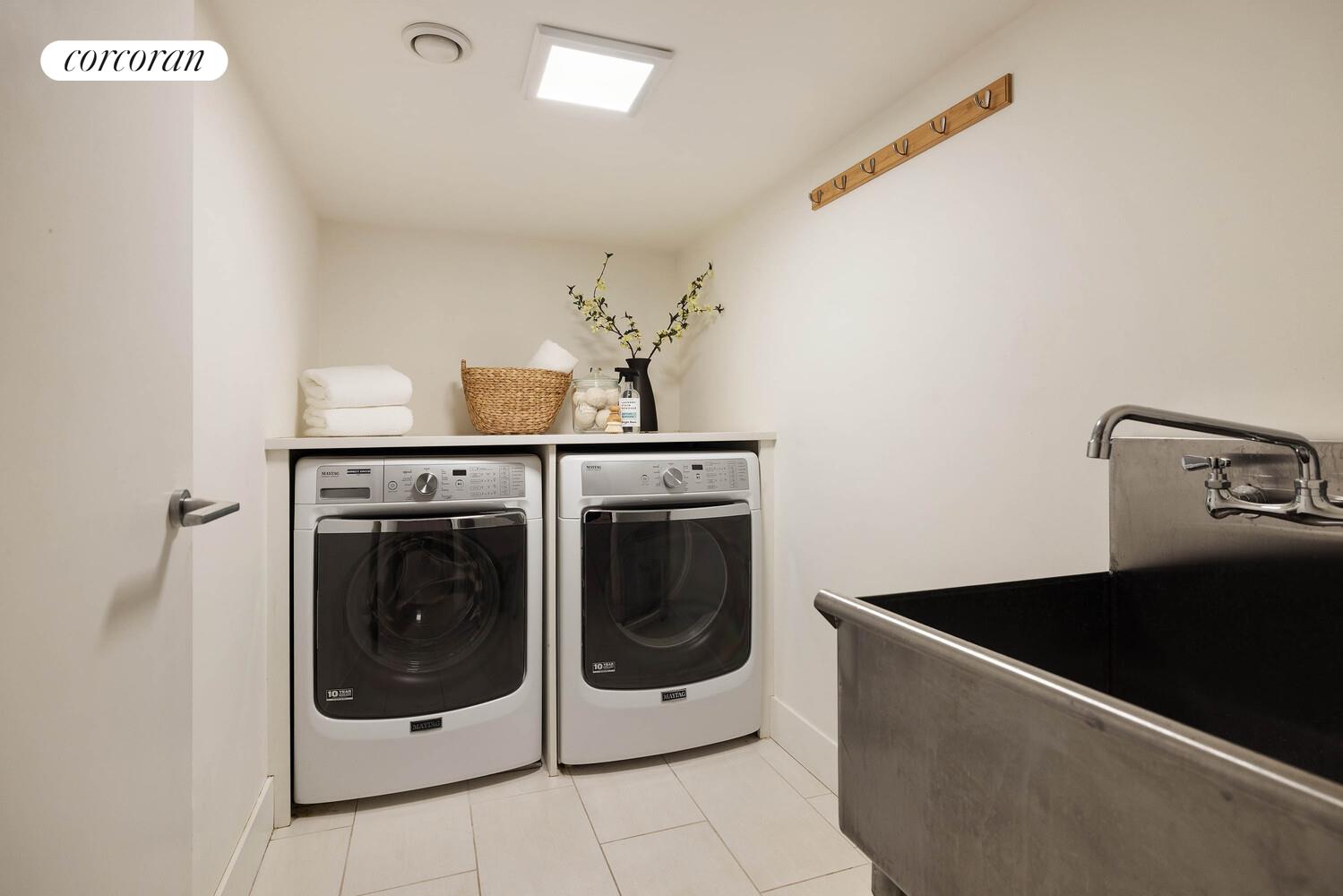 53 West 71st Street Manhattan, NY 10023 - Photo 39 of 41 a utility room with dryer and washer