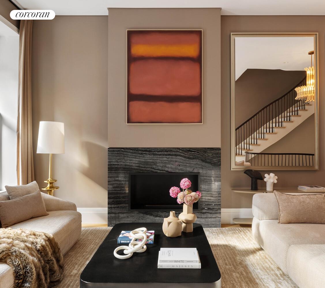 53 West 71st Street Manhattan, NY 10023 - Photo 5 of 41 a living room with furniture and a fireplace