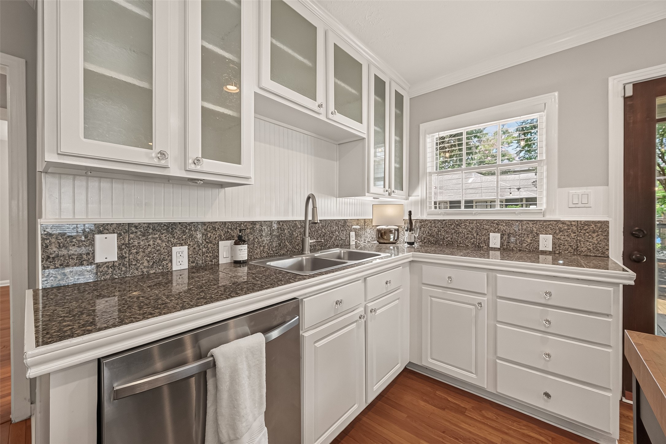 2019 Gostick Street Houston, TX 77008 - Photo 20 of 36 a kitchen with white cabinets and sink