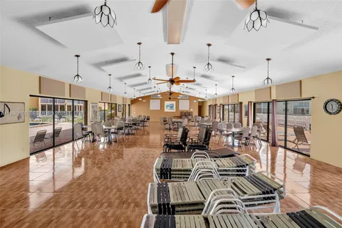 a living room with lots of furniture and a chandelier