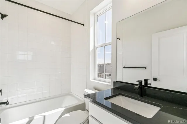 a living room with a couch and a window