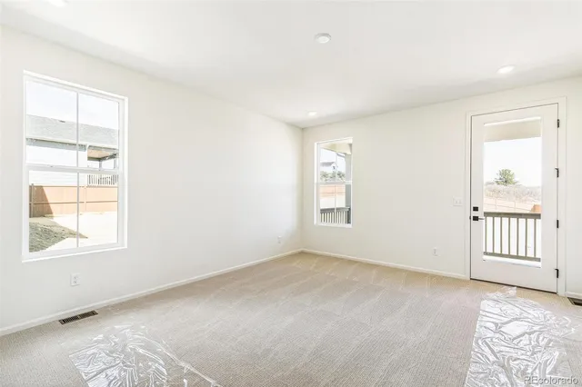 an empty room with windows