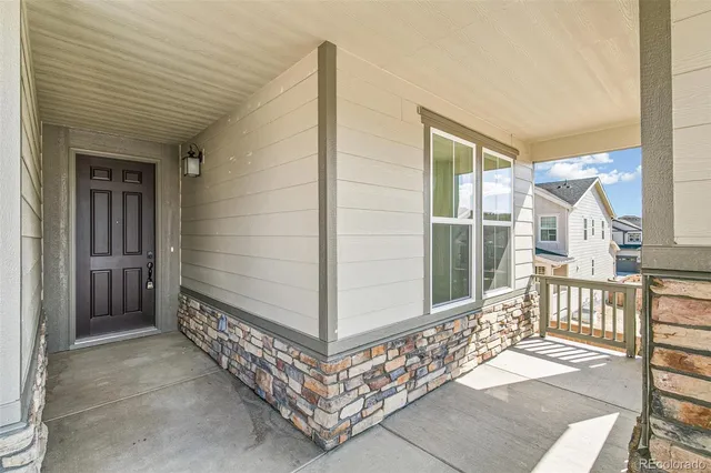 a view of a porch with wooden floor