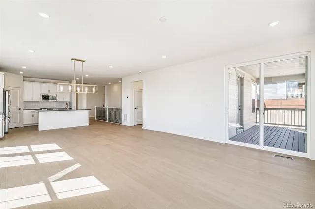 a view of a kitchen with a sink and cabinets
