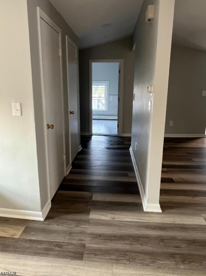 183 Main Street Hackettstown, NJ 07840 - Photo 12 of 12 a view of a hallway with wooden floor and staircase