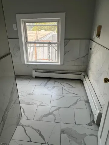 a bathroom with a toilet and a bathtub