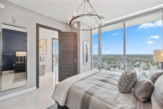 a view of a livingroom with furniture and a flat screen tv
