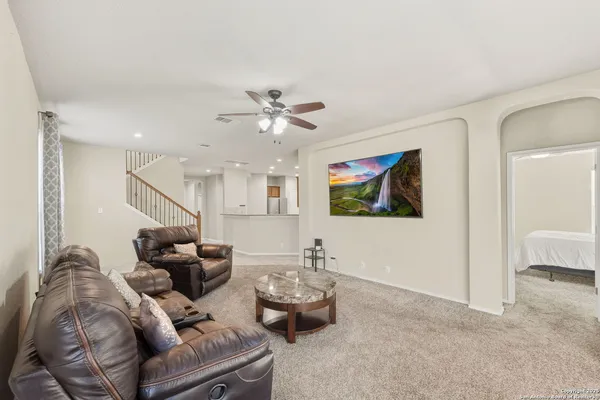 a living room with furniture and a window