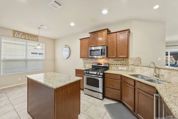 a kitchen with a stove and a microwave