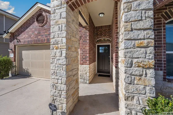 a brick building with a door and a window