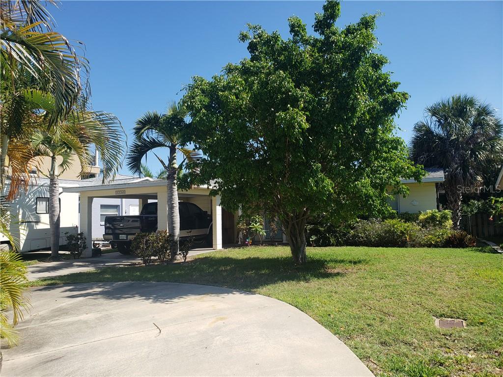 17760 Wall Circle Redington Shores, FL 33708 - Photo 1 of 1 a front view of a house with a yard