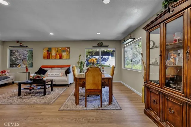 a kitchen with stainless steel appliances granite countertop a stove refrigerator and a sink