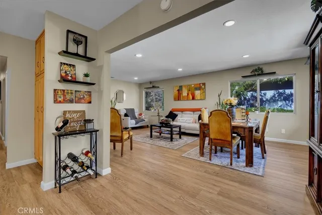 a kitchen with a refrigerator and a stove top oven