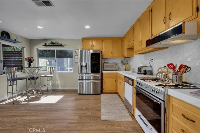 a bedroom with bed and painting on the wall