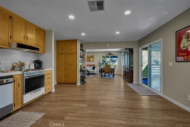 a bedroom with bed and a chandelier